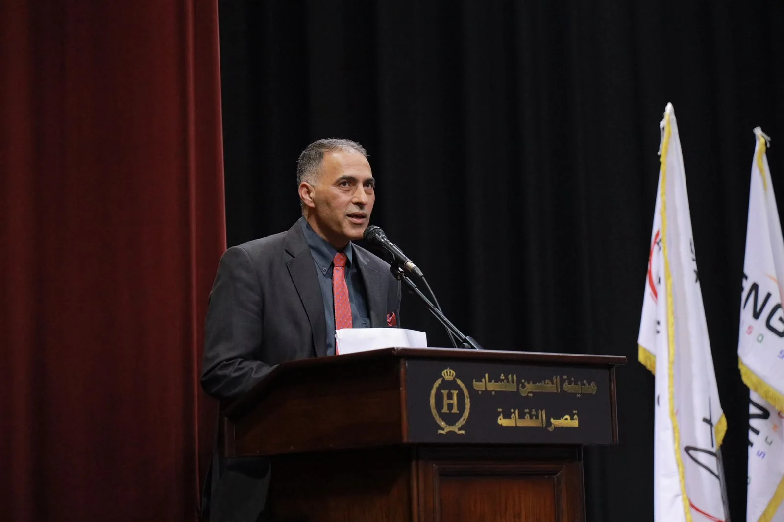 Dr. Anwar Shaqar speaking at a conference
